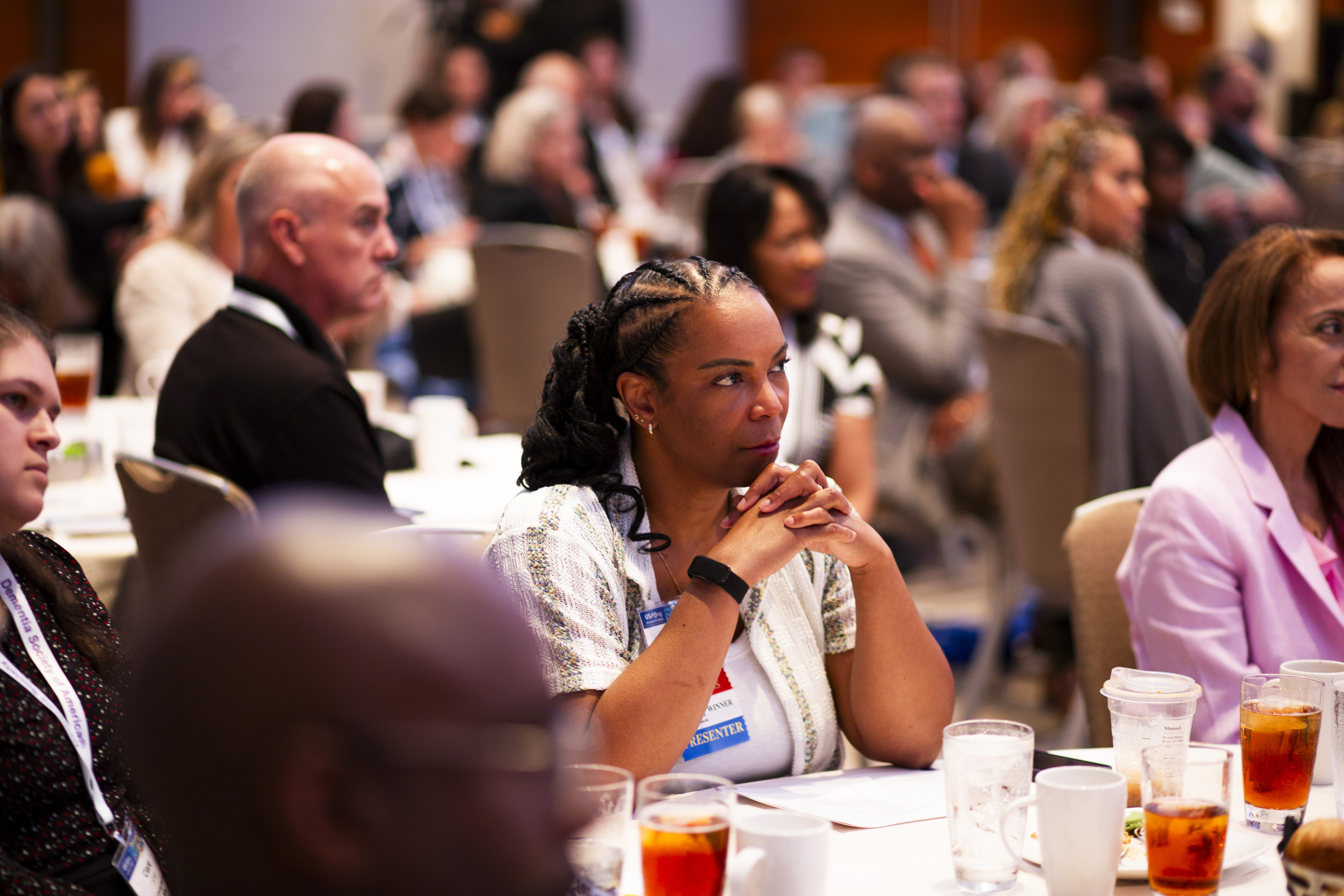 USAging Board member Shannah Tharp Gilliam sits in the center of a well-attended session listening intently to the speaker.